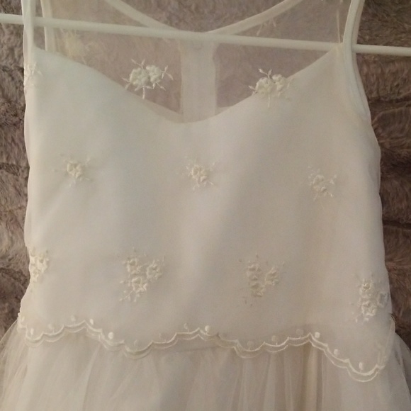 Girls white dress with loose petals in skirt - Picture 2 of 5